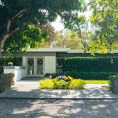 Midcentury modern home in Pinecrest with Pickleball court